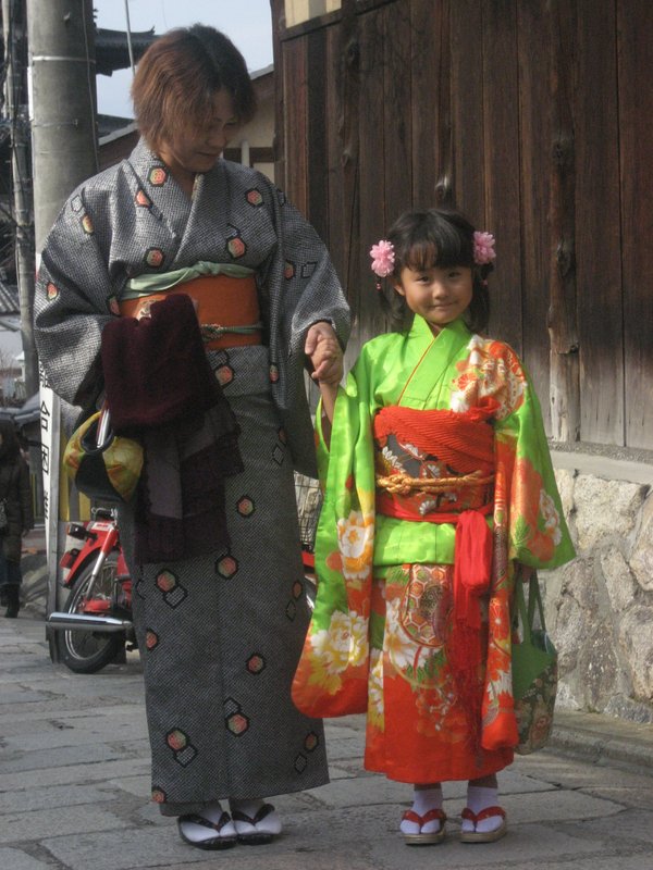 Daily life modern Japan is still alive with traditional ways and celebration like this 7-5-3 age ritual girl in kimono in Kyoto