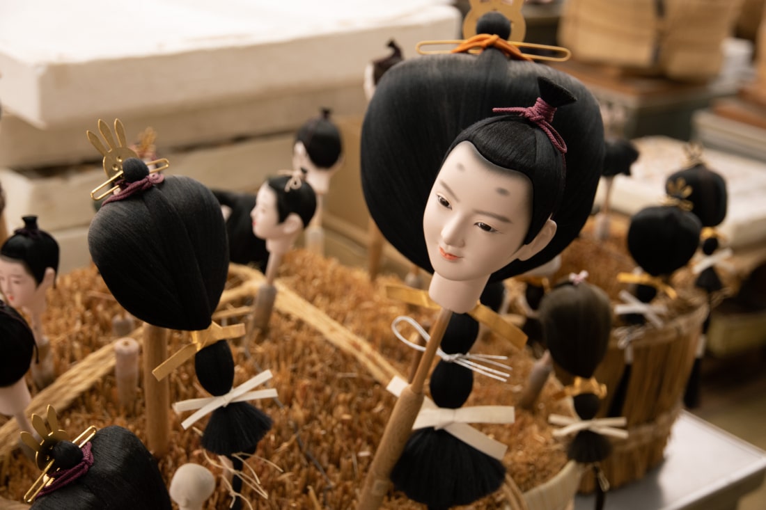Japanese doll heads ready to be attached to the body