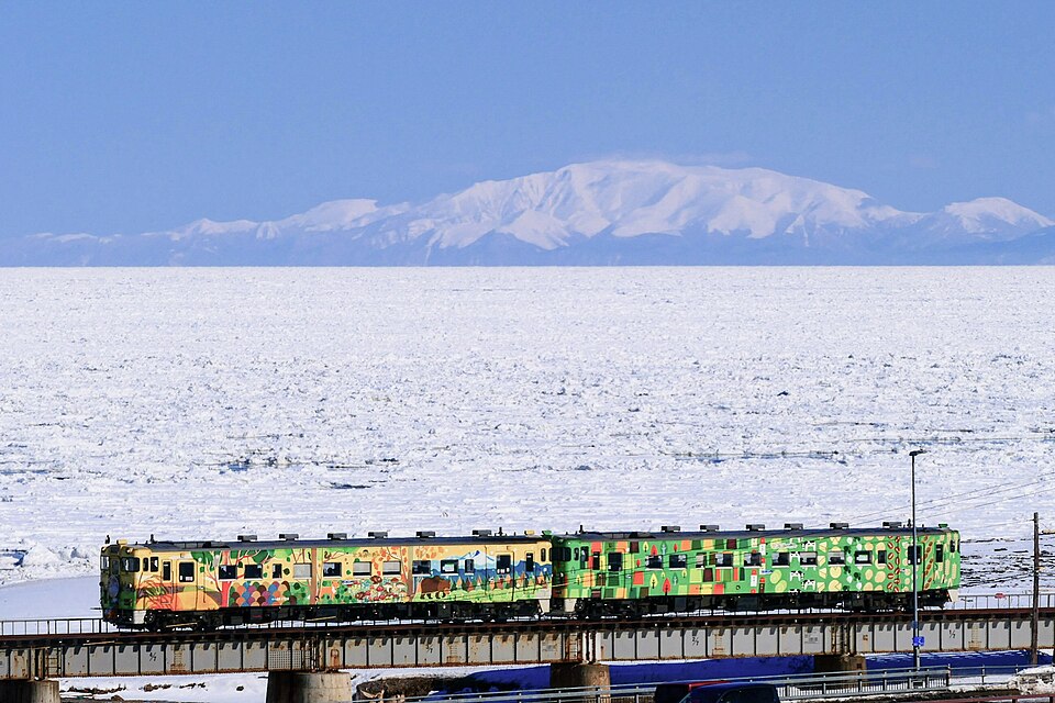 From this train, with Mount Shiretoko in the background, tourists can cruise past Hokkaido's famous ryuhyo drift ice at the height of winter!