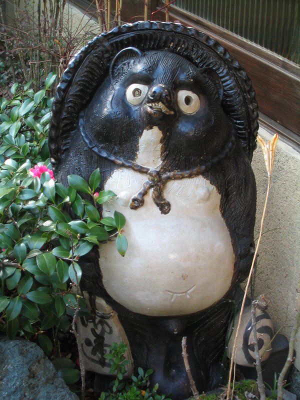 Japan's tanuki badgers, like this one, bring luck to businesses and can also be spiritual humans in disguise.